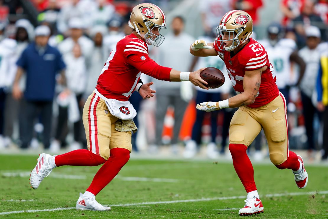 The return of McCaffrey (right) to the 49ers offense should help San Francisco's ground game.