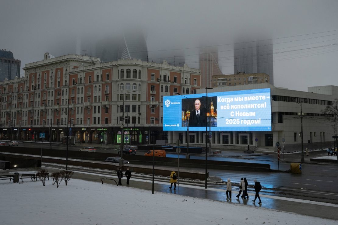 An electronic screen in Moscow shows Putin and shares a New Year's message, January 7, 2025.