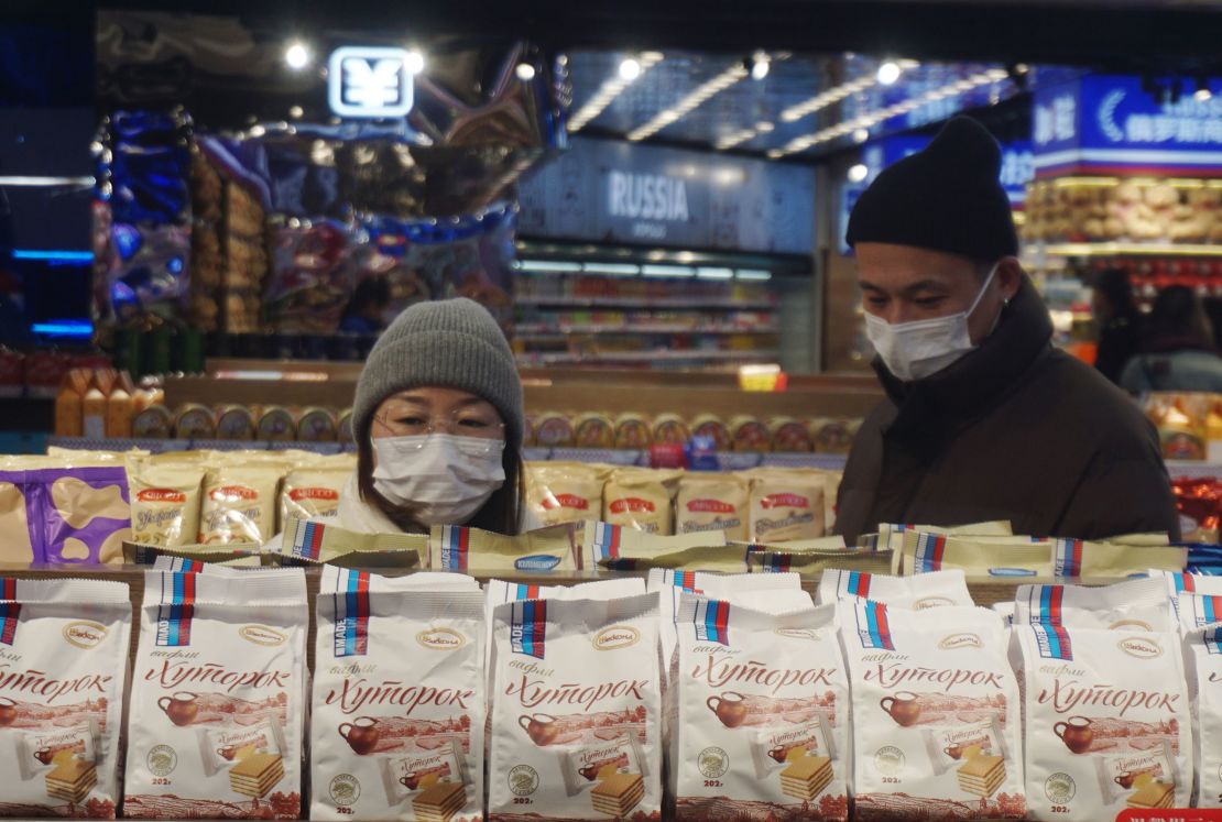 Shoppers behind rows of Russian sweet biscuits at a store in Hangzhou, Zhejiang province, China, on January 9.