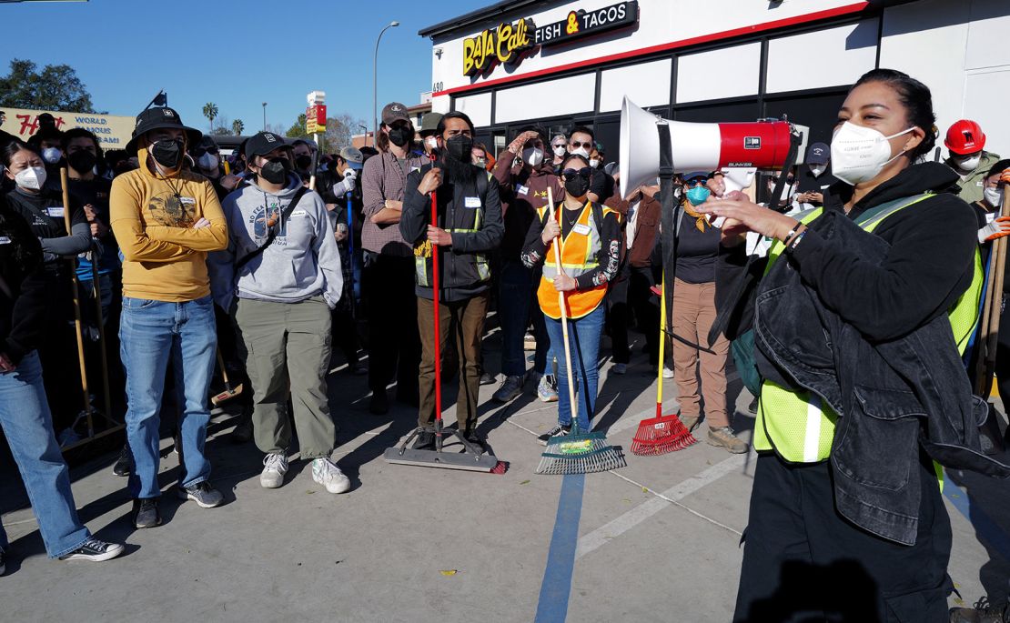 Volunteers gather at the Pasadena Community Job Center to help clean up after the fires on January 12.