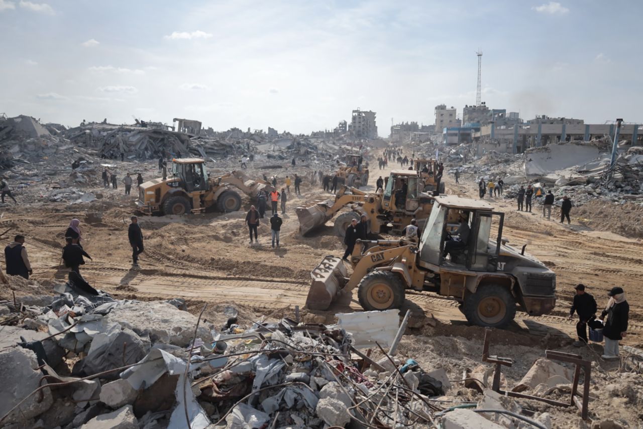 Construction vehicles begin to clean up in Jabalia refugee camp, Gaza, on Sunday.