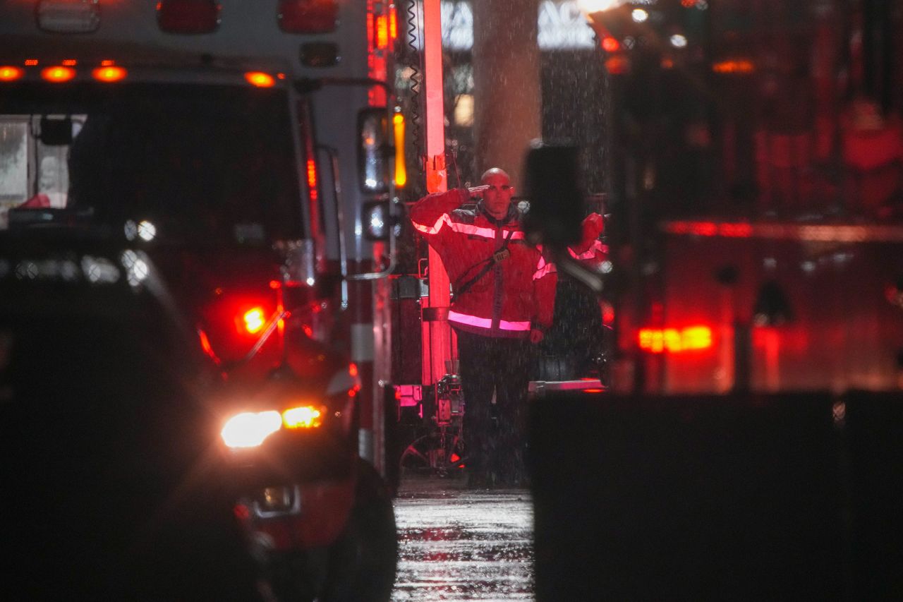 A first responder salutes.