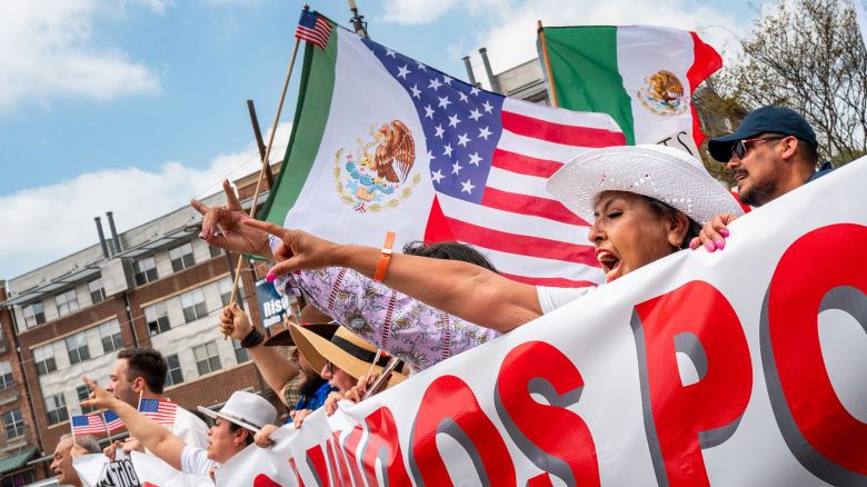 People march through downtown in protest against the Trump administration’s immigration policies during the “2025 Mega March” on March 30 in Dallas.