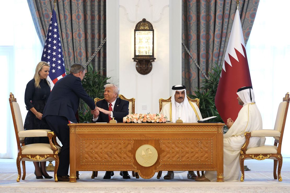 President Donald Trump shakes hands with Kelly Ortberg, CEO of Boeing, during a signing ceremony at the Amiri Diwan, the official workplace of the emir, on May 14, 2025, in Doha, Qatar.