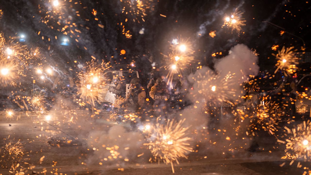 TOPSHOT - Los Angeles County Sheriffs are seen as law enforcement clashes with demonstrators during a protest following federal immigration operations, in the Compton neighborhood of Los Angeles, California on June 7, 2025. US President Donald Trump deployed 2,000 troops on June 7, 2025 to handle escalating protests against immigration enforcement raids in the Los Angeles area, a move the state's governor termed "purposefully inflammatory." Federal agents clashed with angry crowds in a Los Angeles suburb as protests stretched into a second night Saturday, shooting flash-bang grenades and shutting part of a freeway amid raids on undocumented migrants, reports said. (Photo by RINGO CHIU / AFP) (Photo by RINGO CHIU/AFP via Getty Images)          