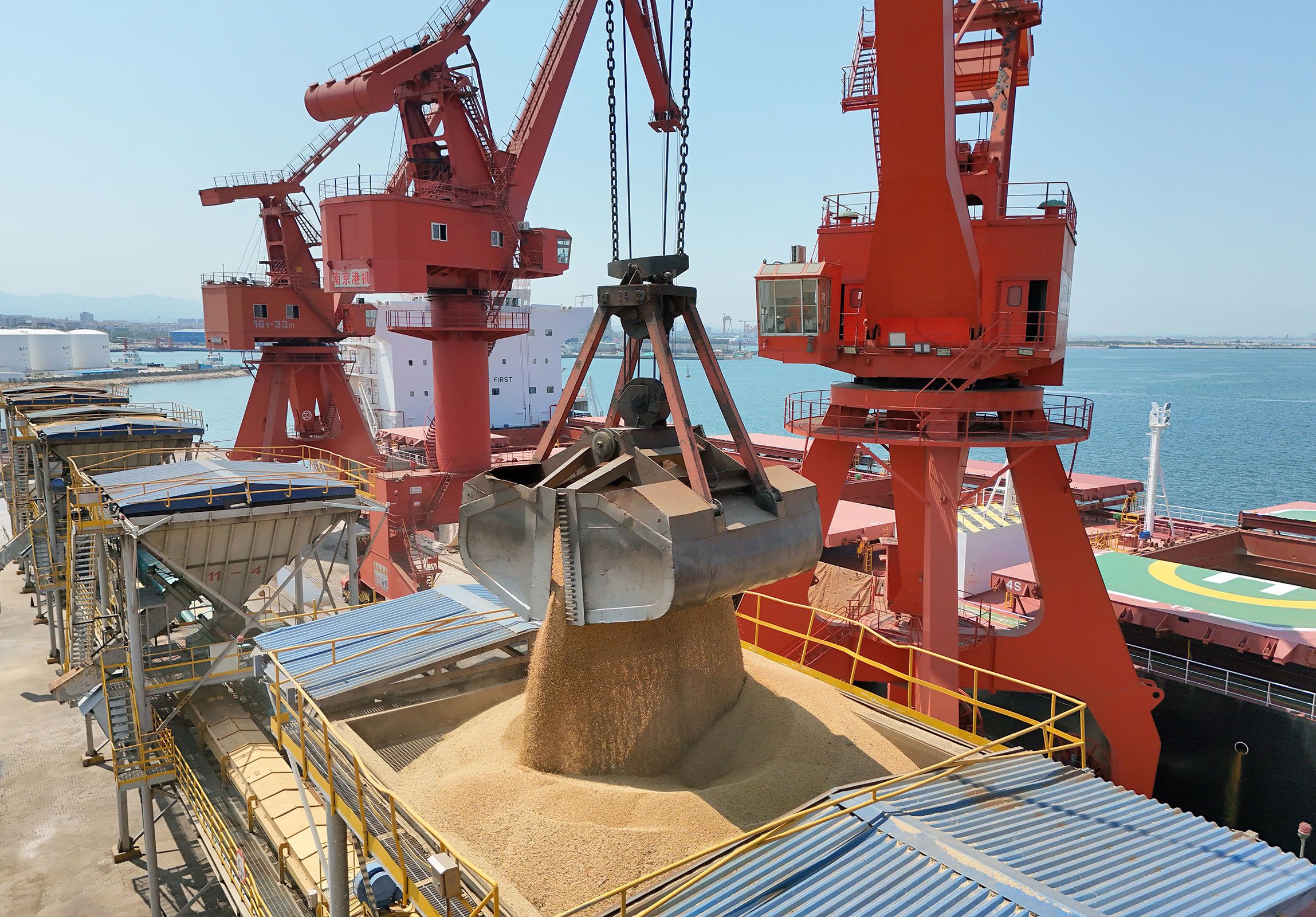 Brazilian soybeans are unloaded from a ship at  Yantai Port in China