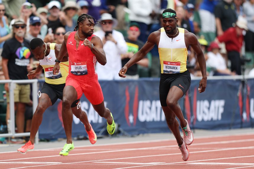 Lyles looks across at Bednarek as he wins the 200m national title.