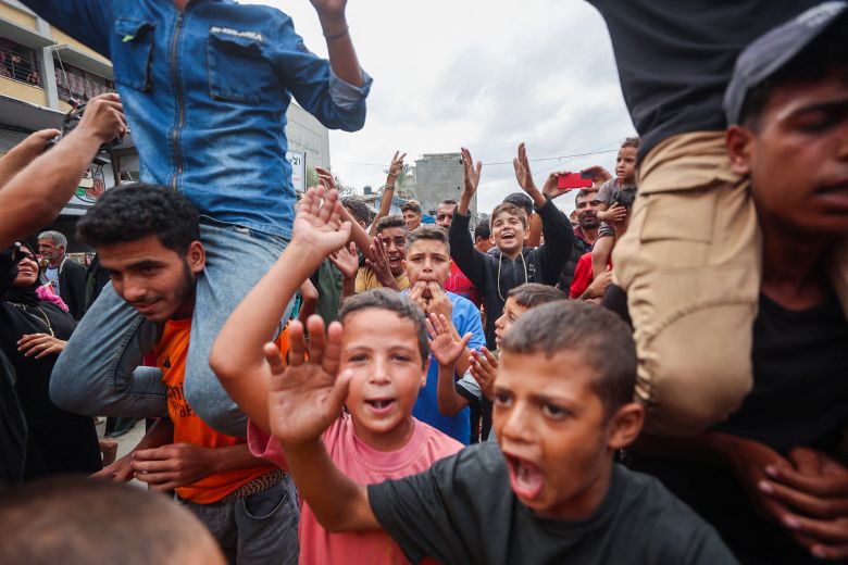 Palestinian children celebrate in Khan Yunis on Thursday.