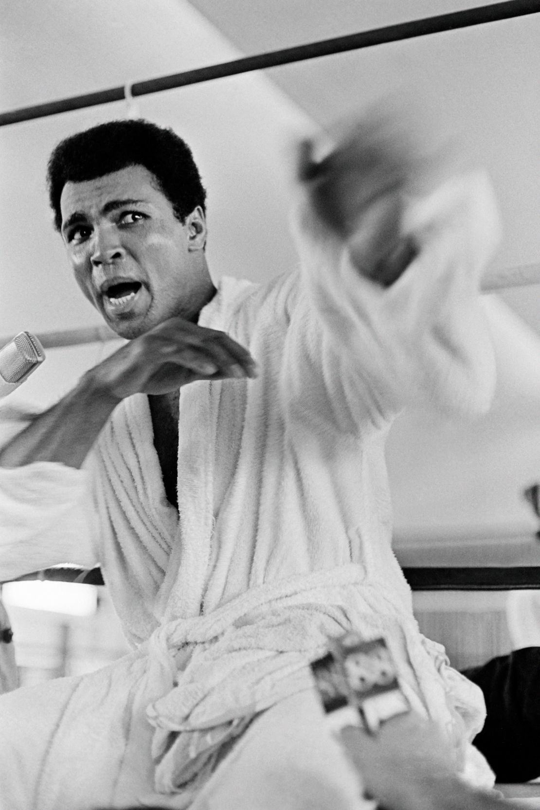 Ali speaks to the press while practicing a jab in Kinshasa, Zaire, October 27, 1974.