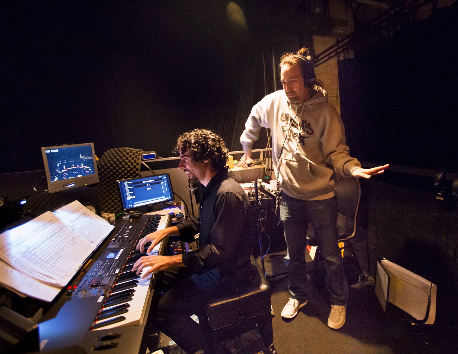 Miranda dances behind musical director Alex Lacamoire during a rehearsal in April 2015.