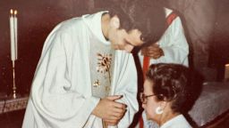 Robert Prevost blesses his mother after being ordained in this undated photo.