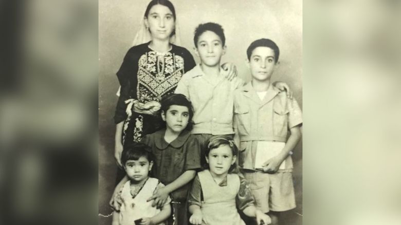 Mohammed Zarqa, top center, and his five siblings when they lived as refugees in Jordan, waiting to return to their homeland.