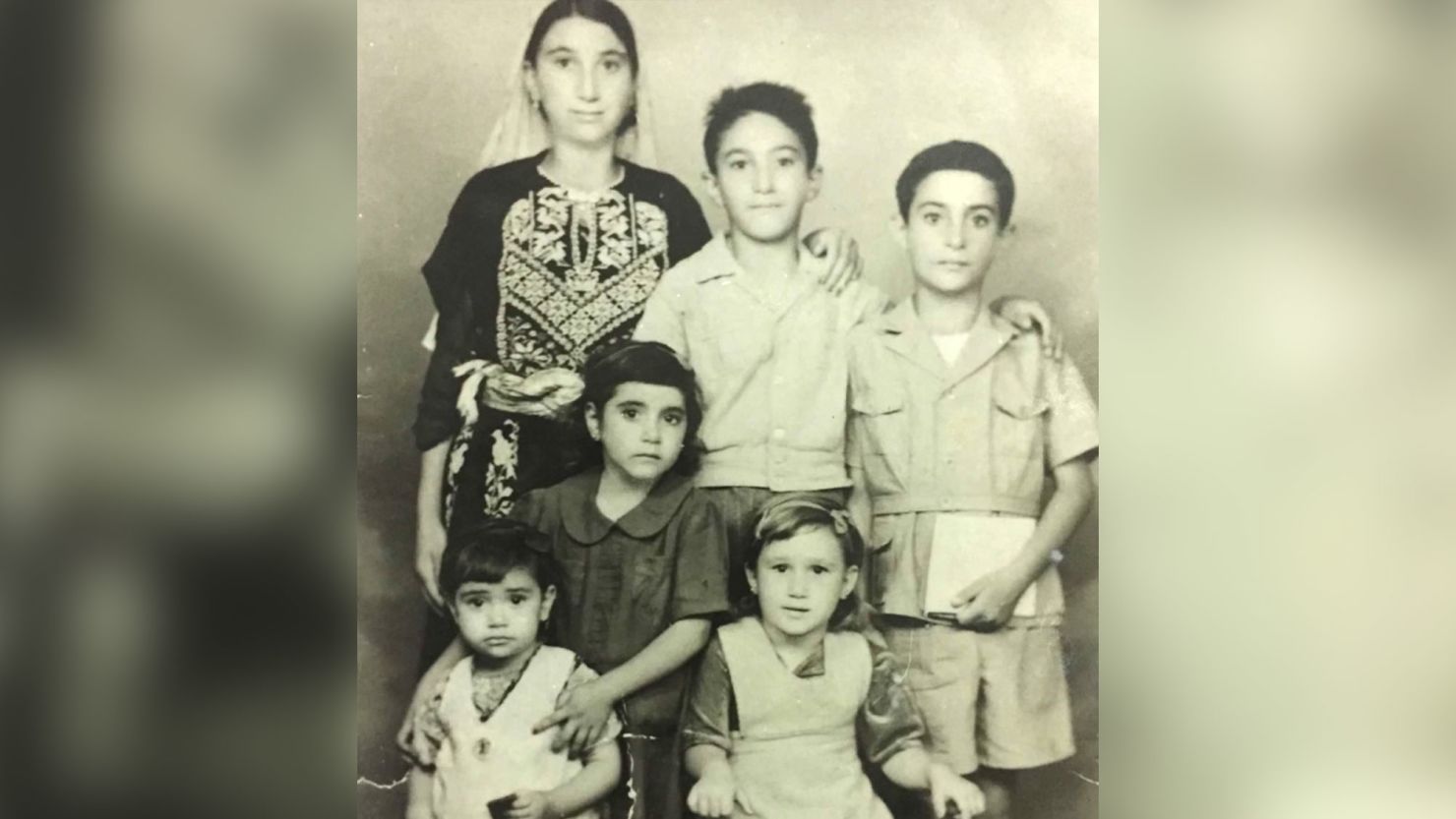 Mohammad Zarqa, top center, poses with some of his siblings in the British Mandate of Palestine in 1946. The family was among roughly 700,000 Palestinians who fled or were expelled from their homes in 1948 during al-Nakba, as armed Jewish groups sought to establish the state of Israel.