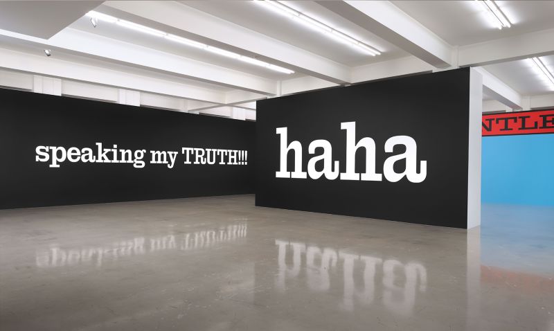 Much of the show is formed of typography on wall-mounted enamel panels.