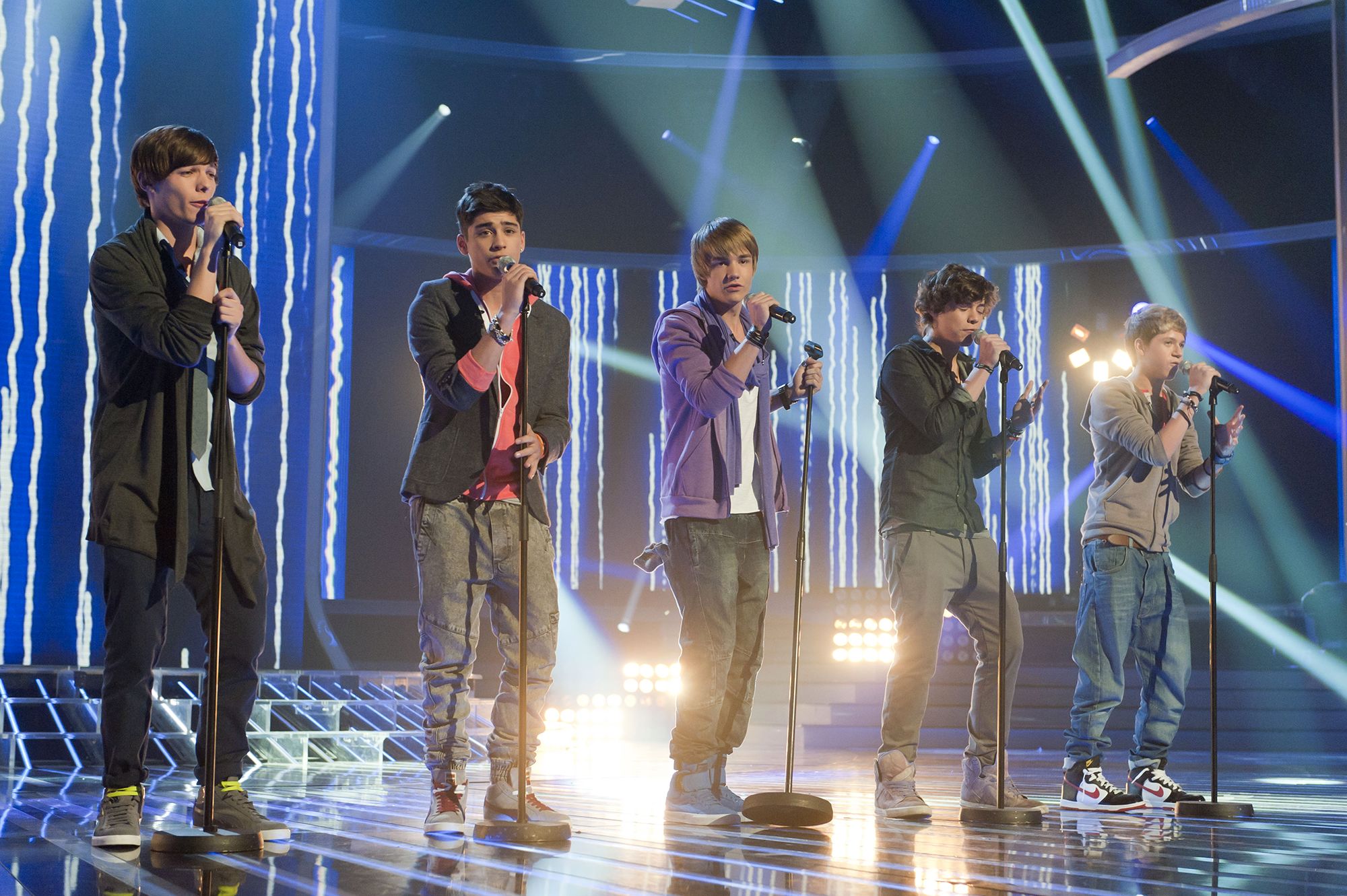 From left: Louis Tomlinson, Zayn Malik, Payne, Harry Styles and Niall Horan perform as One Direction on "The X Factor" in 2010.