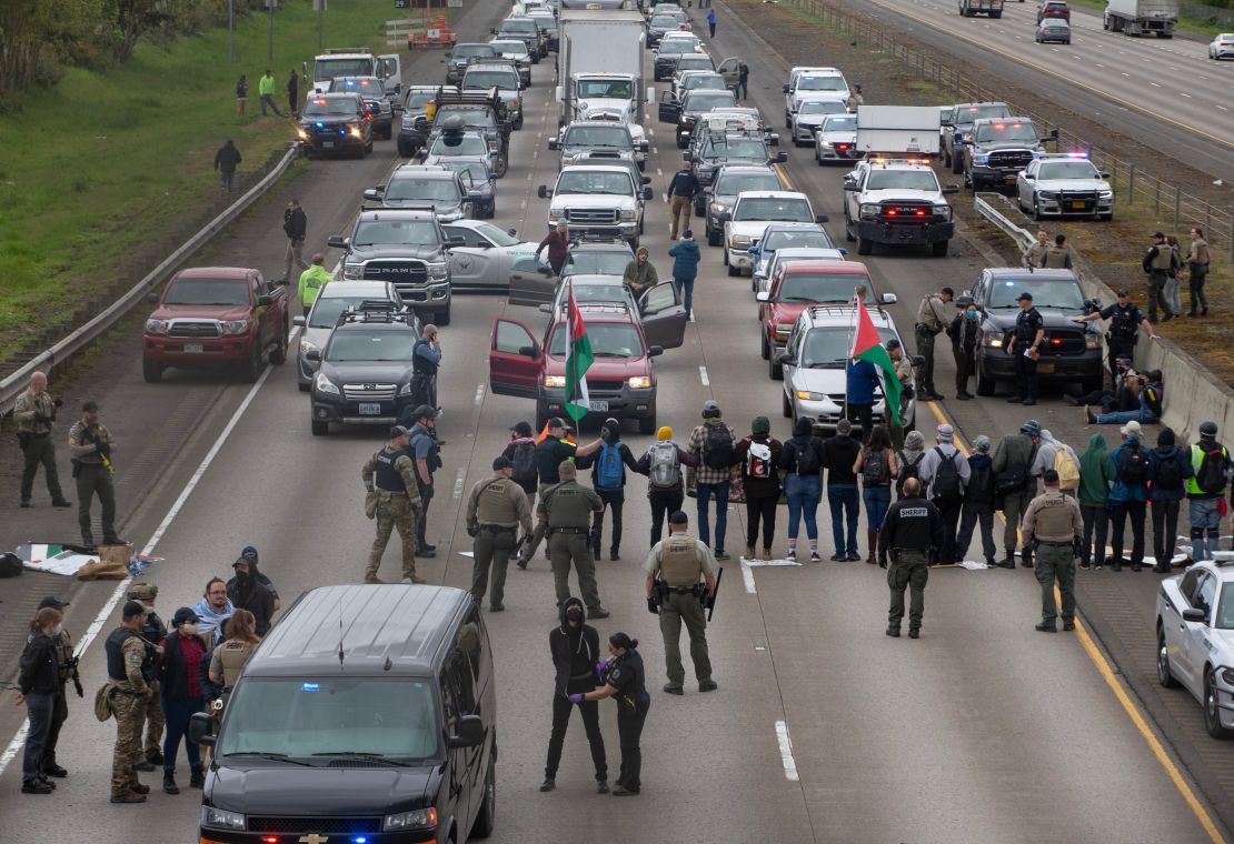 Demonstrators prevent traffic from using the southbound lanes of Interstate 5 near Eugene, Oregon.