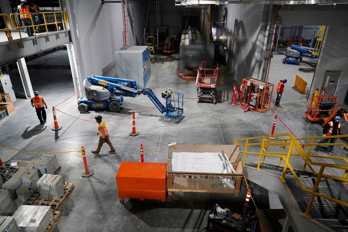 Workers walk inside the paint shop at a Scout Motors car plant under construction in Blythewood, South Carolina, on April 10.