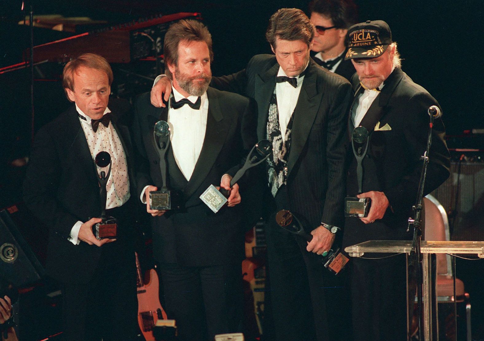 The Beach Boys are inducted into the Rock 'n' Roll Hall of Fame in 1988. From left are Jardine, Carl Wilson, Brian Wilson and Love.