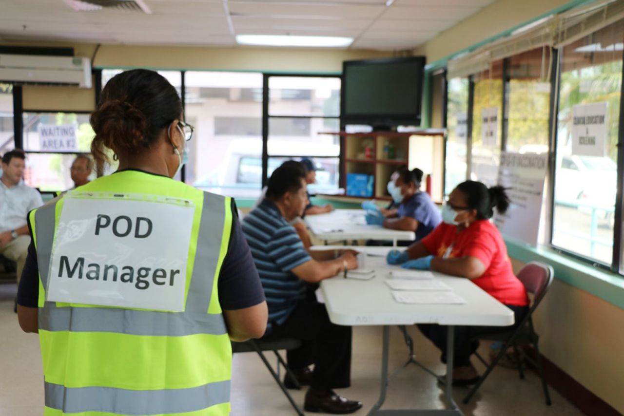 Health workers give Palau citizens their first dose of the Moderna Covid-19 vaccination.