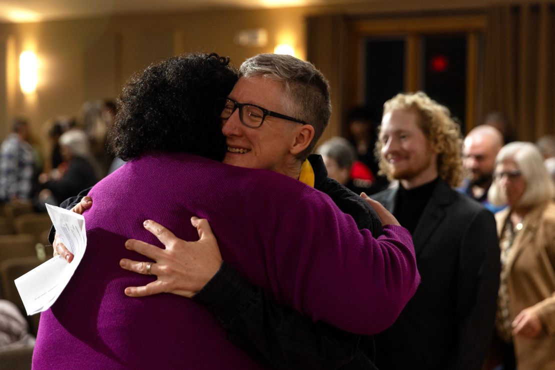 Vienna Cavazos hugs Rev. Cathy Rion Starr following the remembrance event. Cavazos praised the trans community's resilience. "We faced endless challenges and discrimination yet we’ve endured."