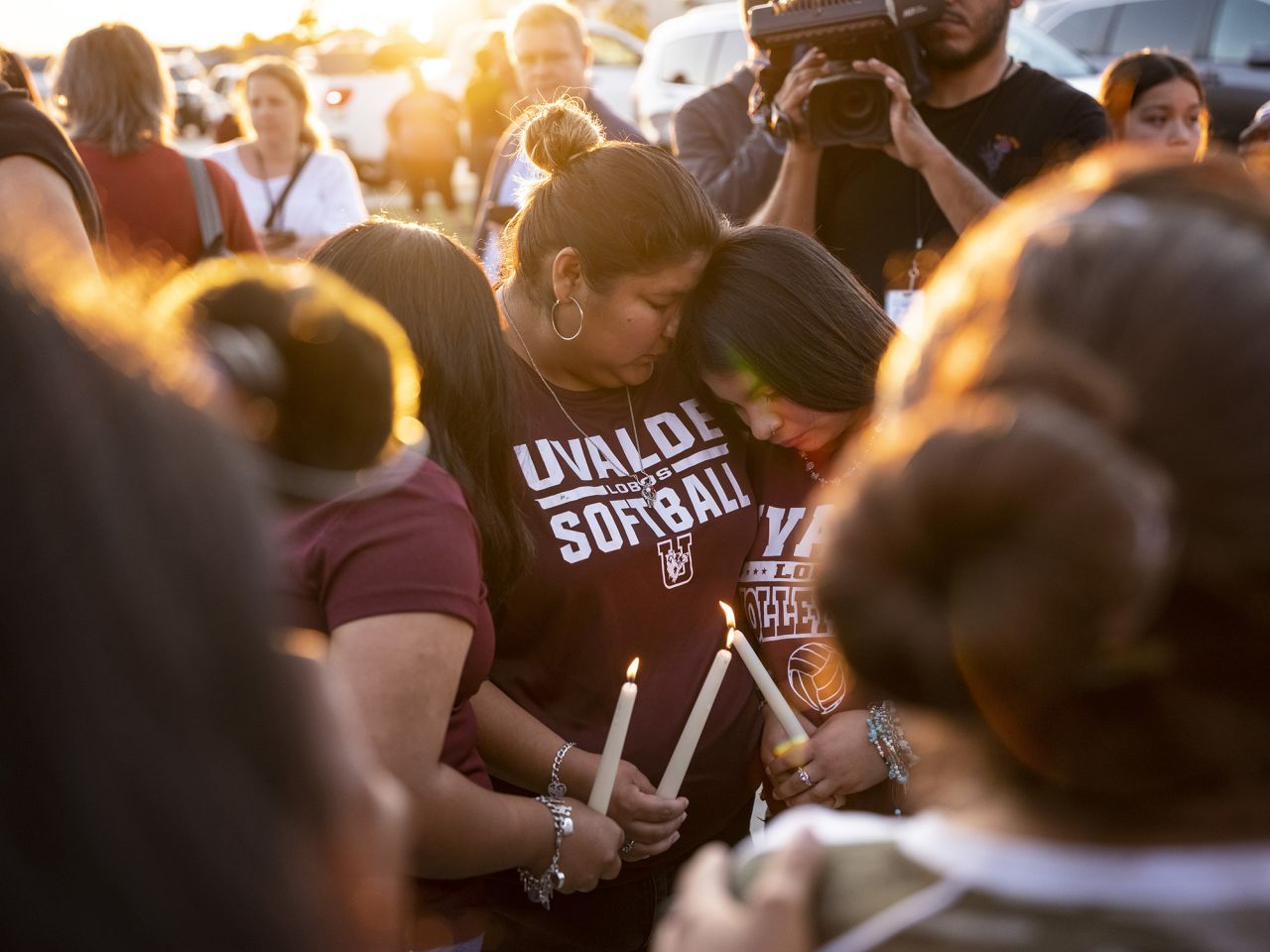 People light candles during a memorial service in Uvalde, Texas on Wednesday, May 25.
