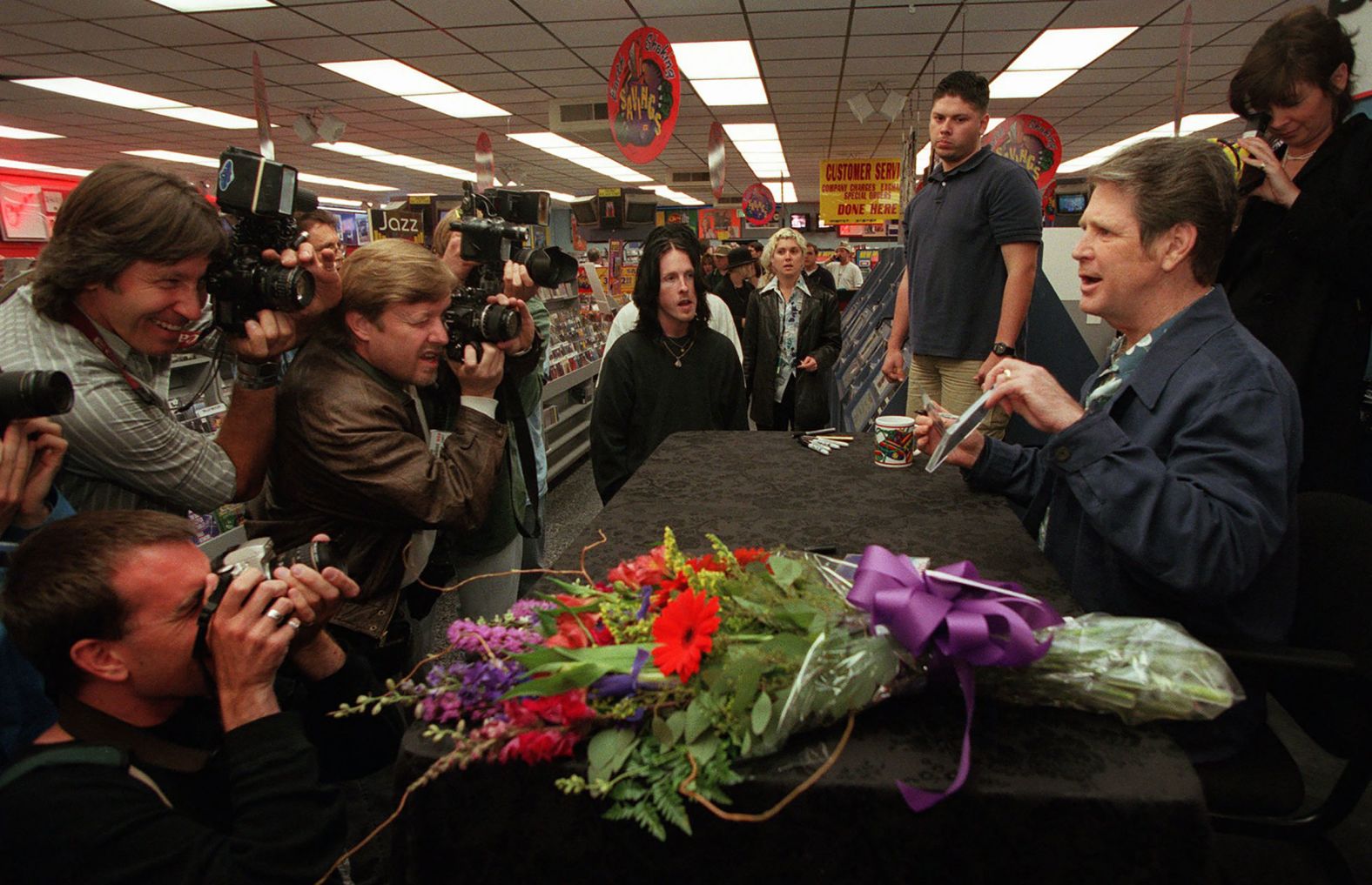 Wilson holds a new solo album, "Imagination," during an in-store appearance at a Tower Records in West Hollywood, California, in 1988. It was his first album in 10 years.