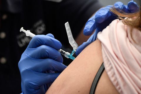 A nurse practitioner administers a dose of the Moderna Covid-19 vaccine at a clinic for Catholic school education workers including elementary school teachers and staff at a vaccination site at Loyola Marymount University (LMU) on March 8, 2021 in Los Angeles.