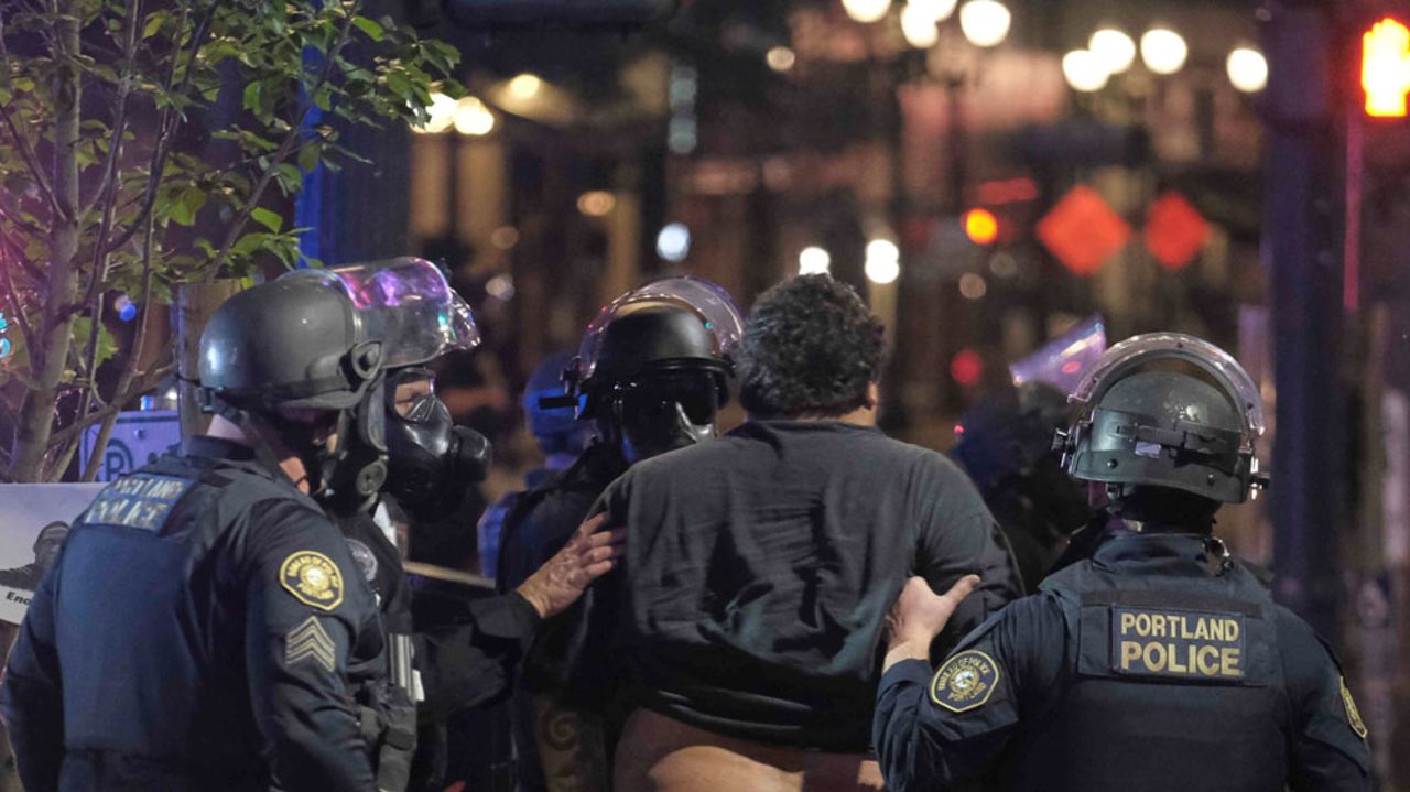 A protester is arrested after curfew on the third night of protests over the murder of George Floyd in Portland, Oregon, on May 31. 