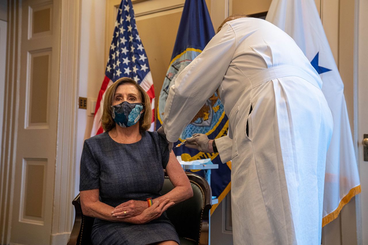 U.S. House Speaker Nancy Pelosi receives the Pfizer-BioNTech SE Covid-19 vaccine at the U.S. Capitol in Washington DC, on Friday, December 18. 