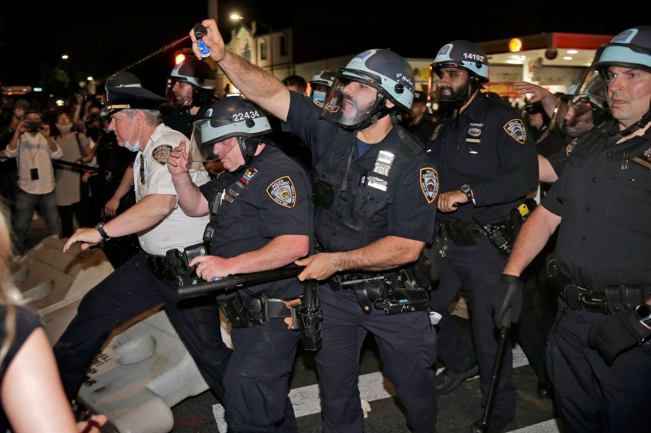 Police scuffle with protesters in Brooklyn on May 30.