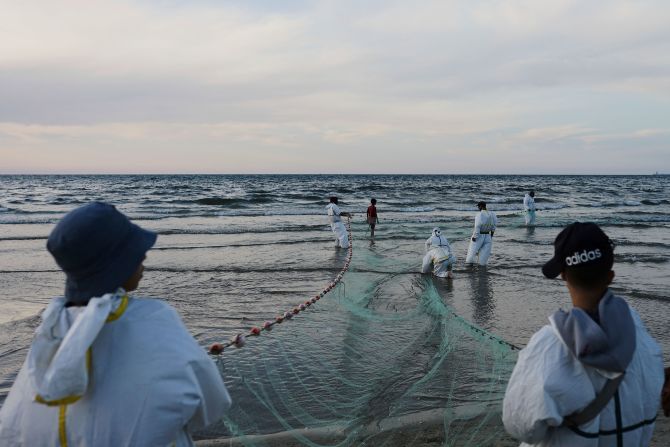 Palestinian fishermen pull their nets out of the Mediterranean Sea at the port of Gaza City on Tuesday, April 29.