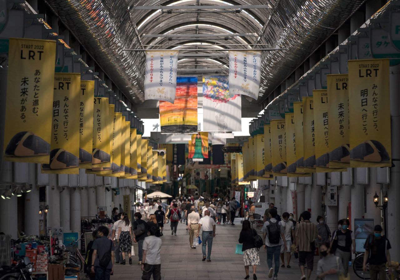 People walk through a shopping street on May 17 in Utsunomiya, Japan. 