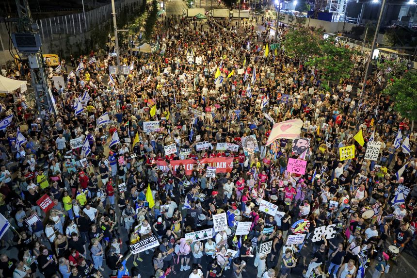 Demonstrators gather outside the Israeli Defence Ministry headquarters in Tel Aviv on July 5, 2025 during an anti-government protest calling for action to secure the release of Israeli hostages held captive in Gaza.