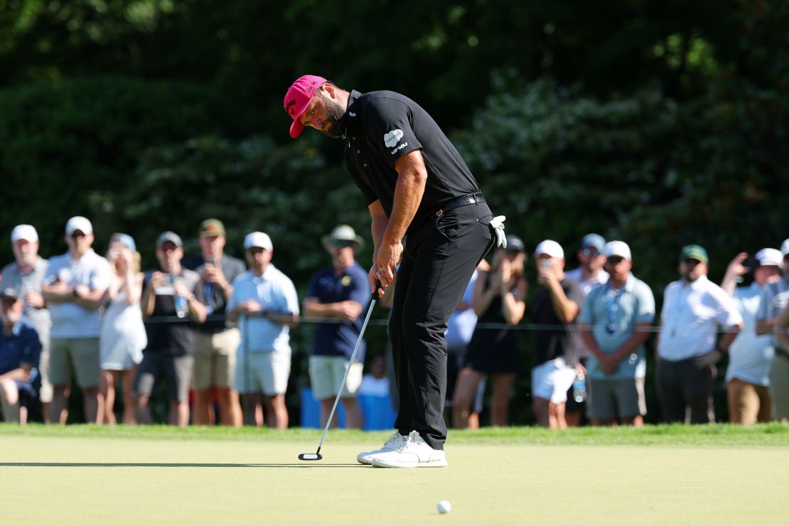 Jon Rahm surged into the lead Sunday before losing it in the back nine to Scheffler.