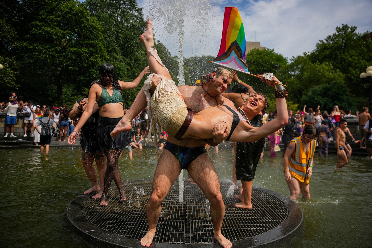 People celebrate in a fountain during the NYC Pride March in New York on Sunday, June 29.