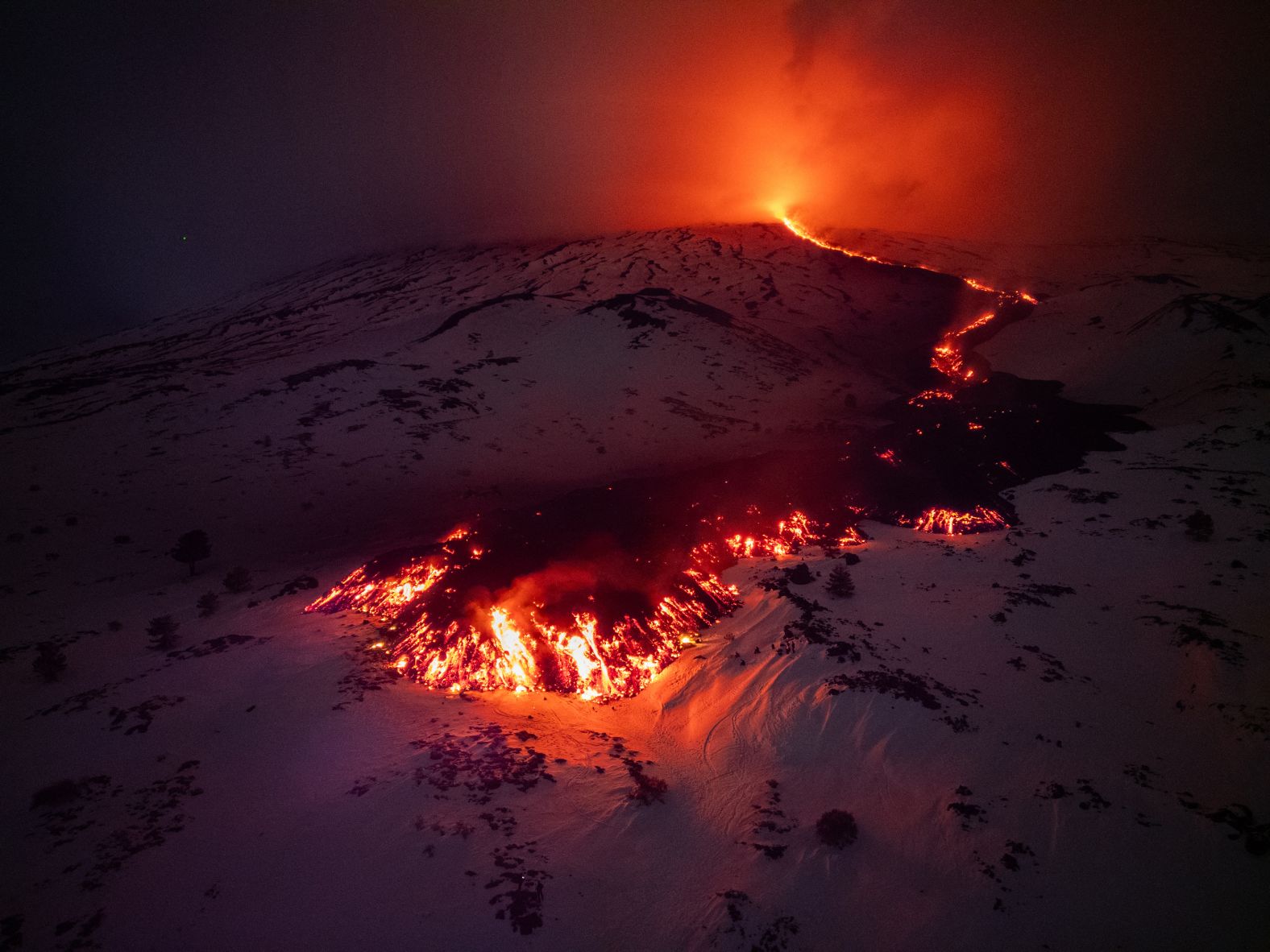 Lava flows from a fracture on Italy’s Mount Etna on Friday, February 14. <a href="https://www.cnn.com/2025/02/18/europe/sicily-mount-etna-tourists-italy-intl-latam/index.html">A week of spectacular lava sprays<strong> </strong>on Mount Etna</a>, one of the world’s most active volcanos, has drawn thousands of people wanting to see the eruption.