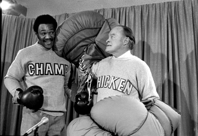 Foreman goofs around with comedian Bob Hope before the taping of a TV special in January 1973.