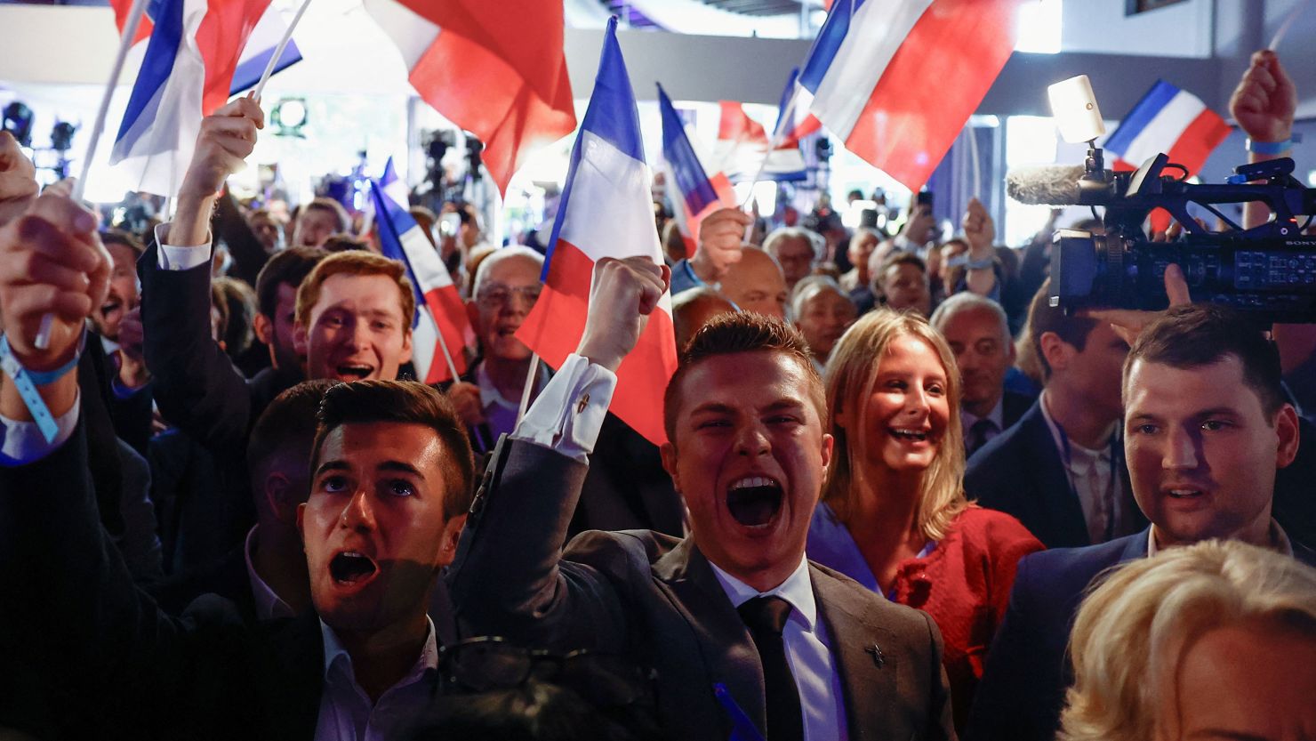 Supporters of France's far-right National Rally party cheer their gains in European Parliament elections, June 9, 2024.