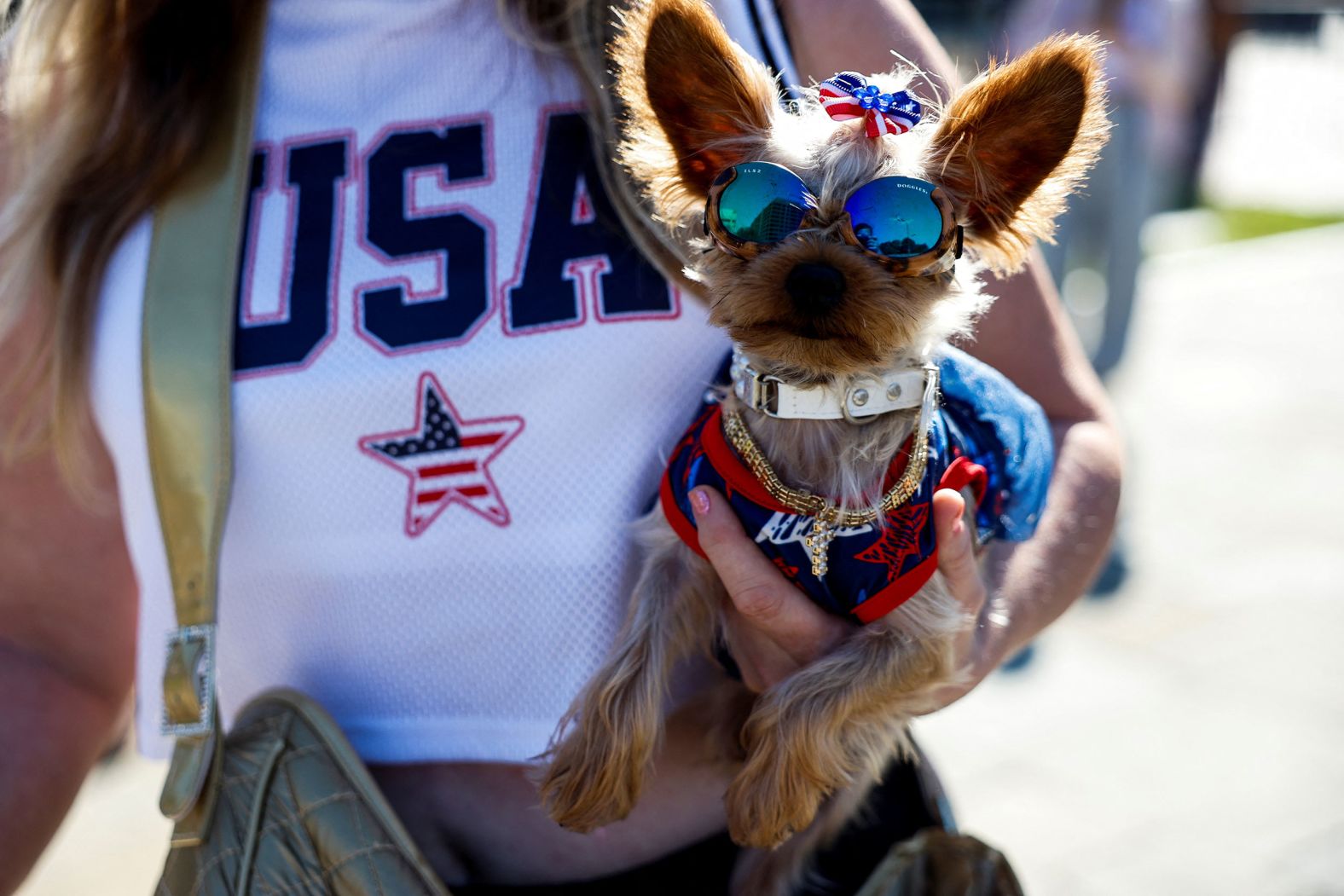 A woman holds Lilly the dog near the National Constitution Center on Tuesday.