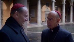 (L to R) Ralph Fiennes as Cardinal Lawrence and Stanley Tucci as Cardinal Bellini in director Edward Berger's CONCLAVE, a Focus Features release.