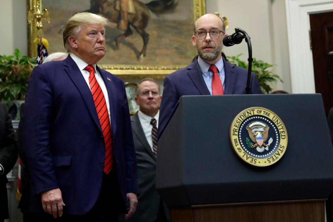 President Donald Trump listens as acting director of the Office of Management and Budget Russell Vought speaks during a White House event in October 2019.