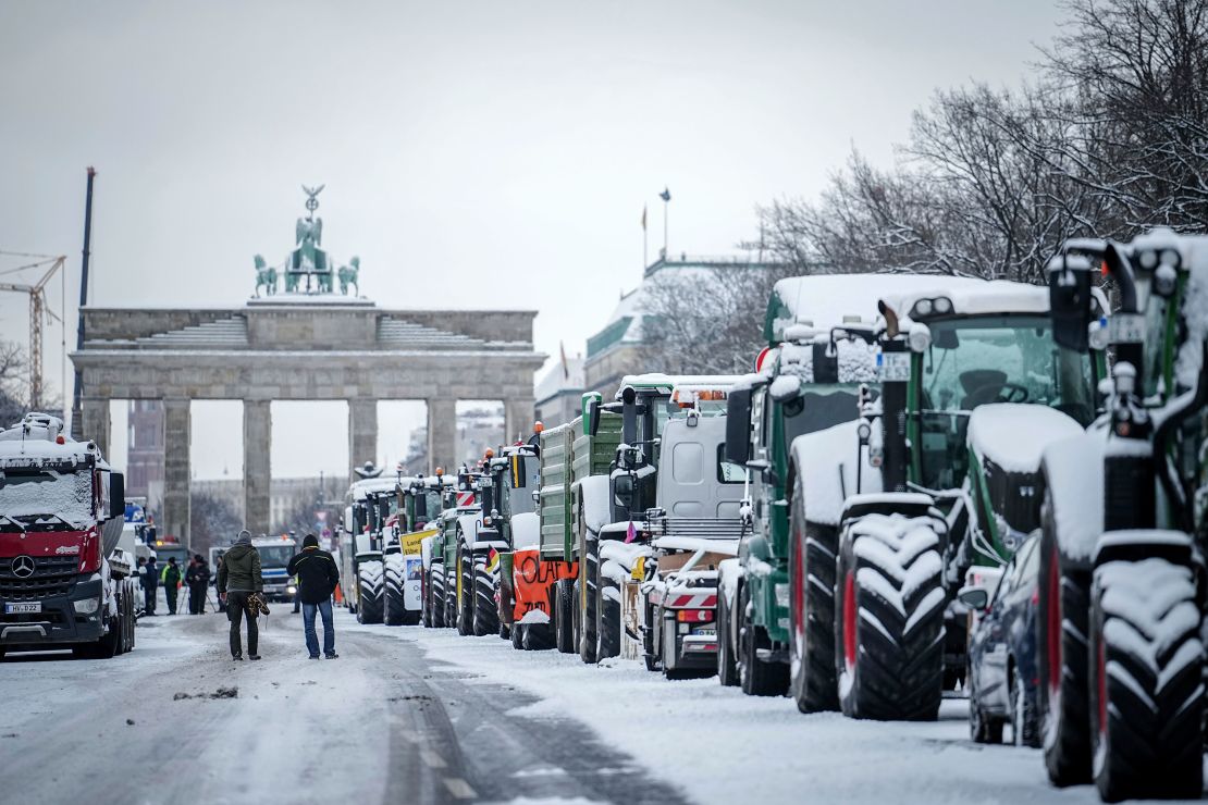 Farmers with tractors protest at the Brandenburg Gate in Berlin, Germany.