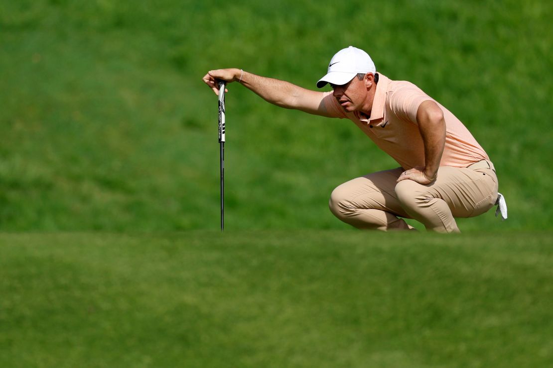 McIlroy lines up a putt during the tournament.