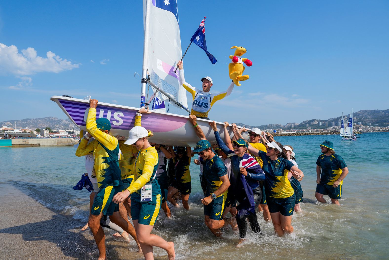 Australia's Matt Wearn celebrates after <a href="https://www.cnn.com/sport/live-news/paris-olympics-news-2024-08-07#h_1842d96d7e8404a5447790c4cfb37060">winning gold in a dinghy sailing race</a> on August 7.