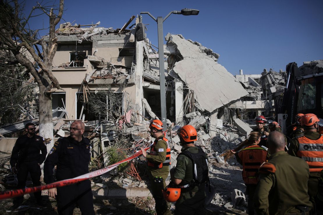 Israeli security forces inspect destroyed houses that were struck by a missile fired from Iran, in Rishon Lezion, Israel on June 14, 2025.