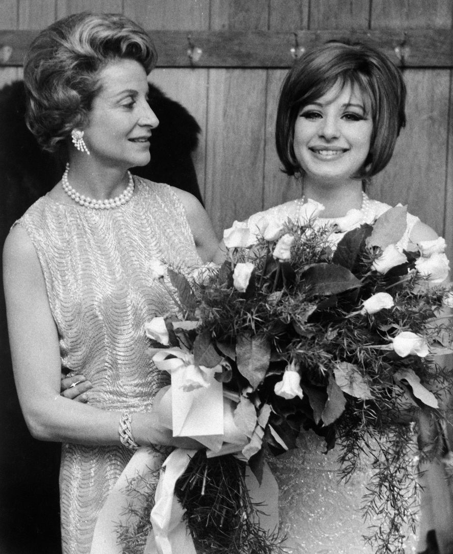 Streisand receives a bouquet from Frances Brice, daughter of the late musical comedy star Fanny Brice, on the opening night of "Funny Girl" in Boston in 1964. The musical is based on the life and career of Fanny Brice.