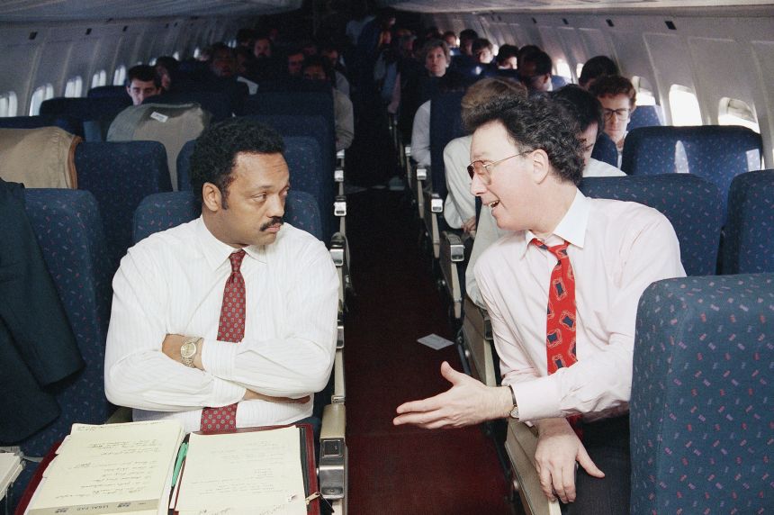 Jesse Jackson and his campaign manager Gerald Austin, on a flight bound for Milwaukee in March 1988.