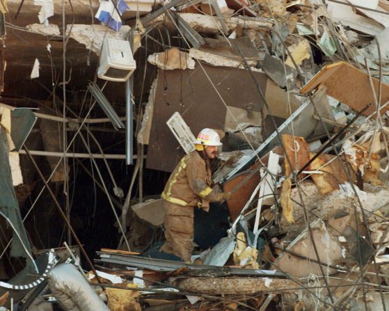 Oklahoma City District Fire Chief Mike Shannon searches through the rubble after the explosion. He was one of the first to arrive on scene.