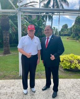 Former President Donald Trump and Brian Butler, right, pose for a photo in July 2022 at Mar-a-Lago in Palm Beach, Florida.