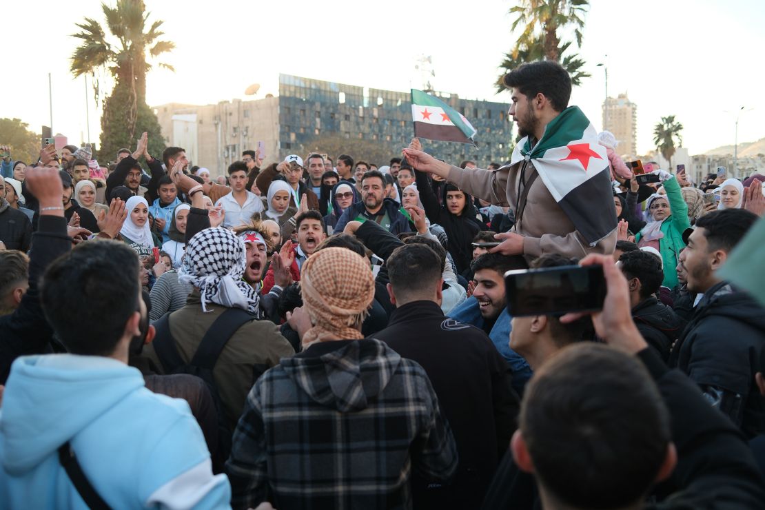 People dance and sing at the Umayyad Square, celebrating their newly found freedoms.